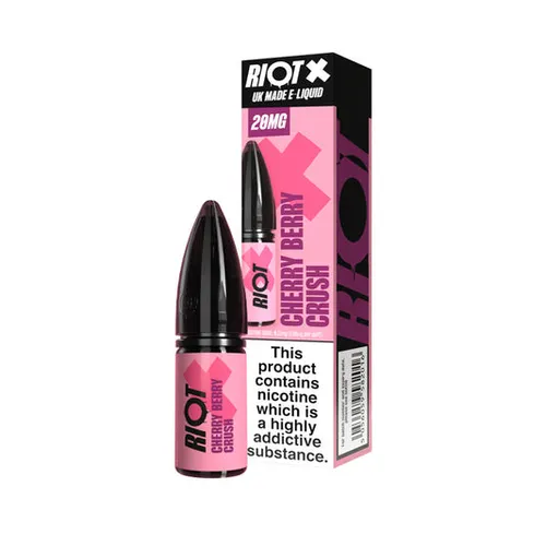 Pink and black Riot X cherry berry crush nicotine vape bottle beside its pink-and-black box, 20 mg, with a prominent warning label on the front.